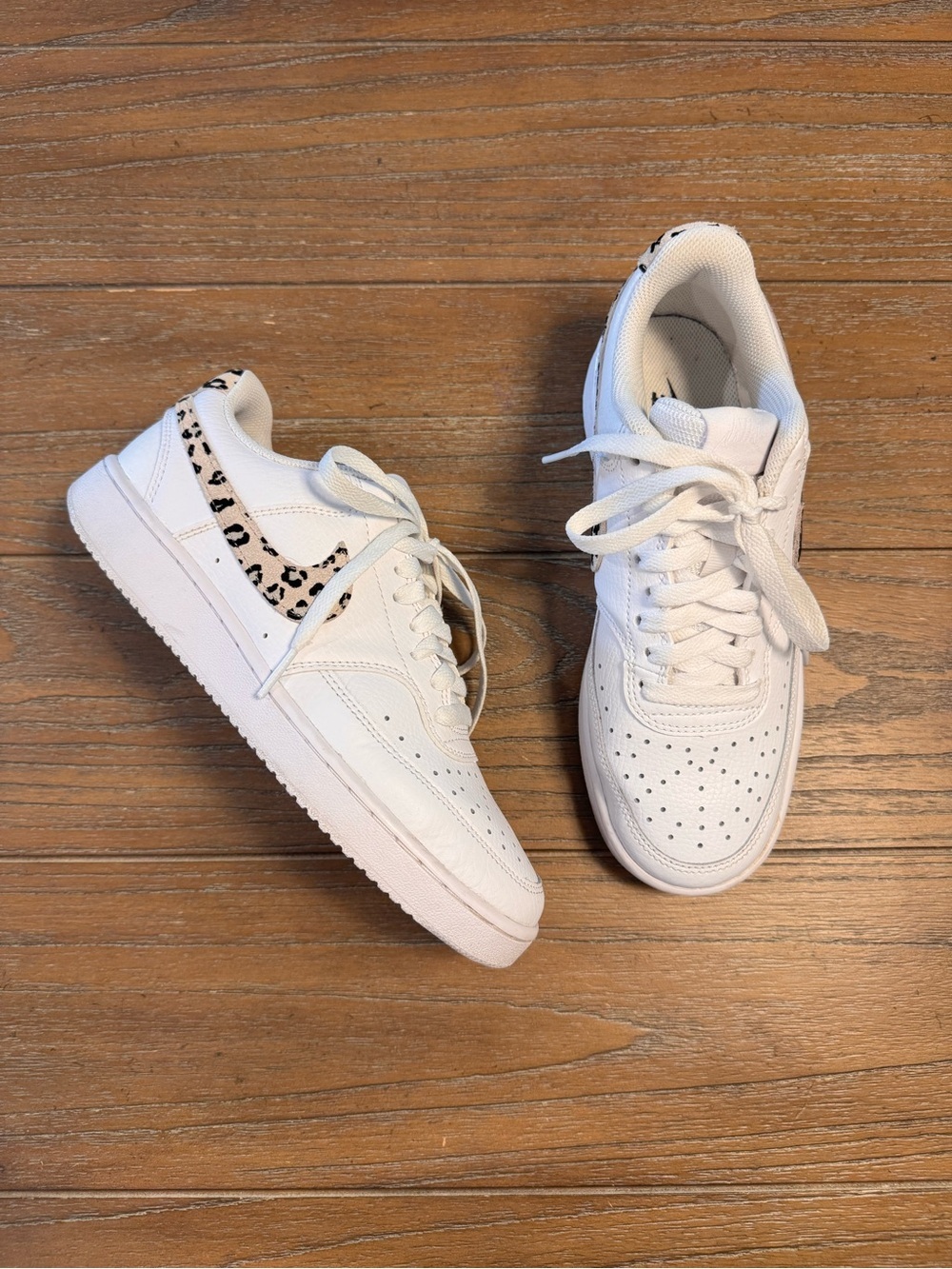 Nike White Low-Top Sneakers with Black Swoosh and Leopard Detail